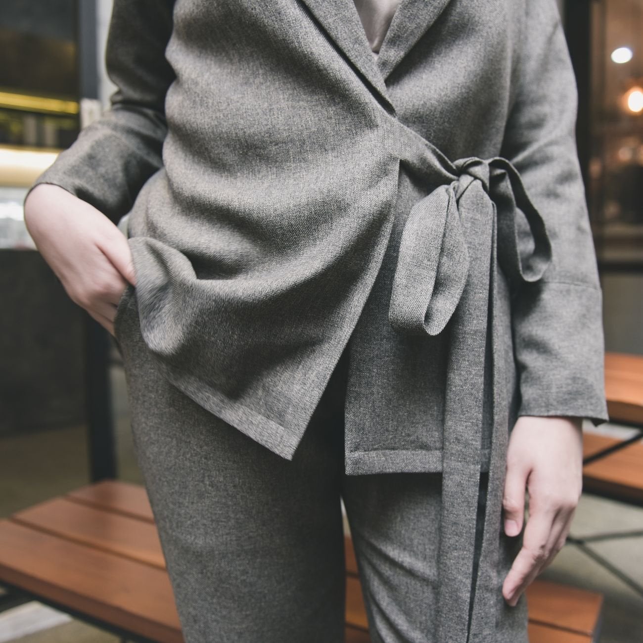 A coordinated women's suit set in neutral grey